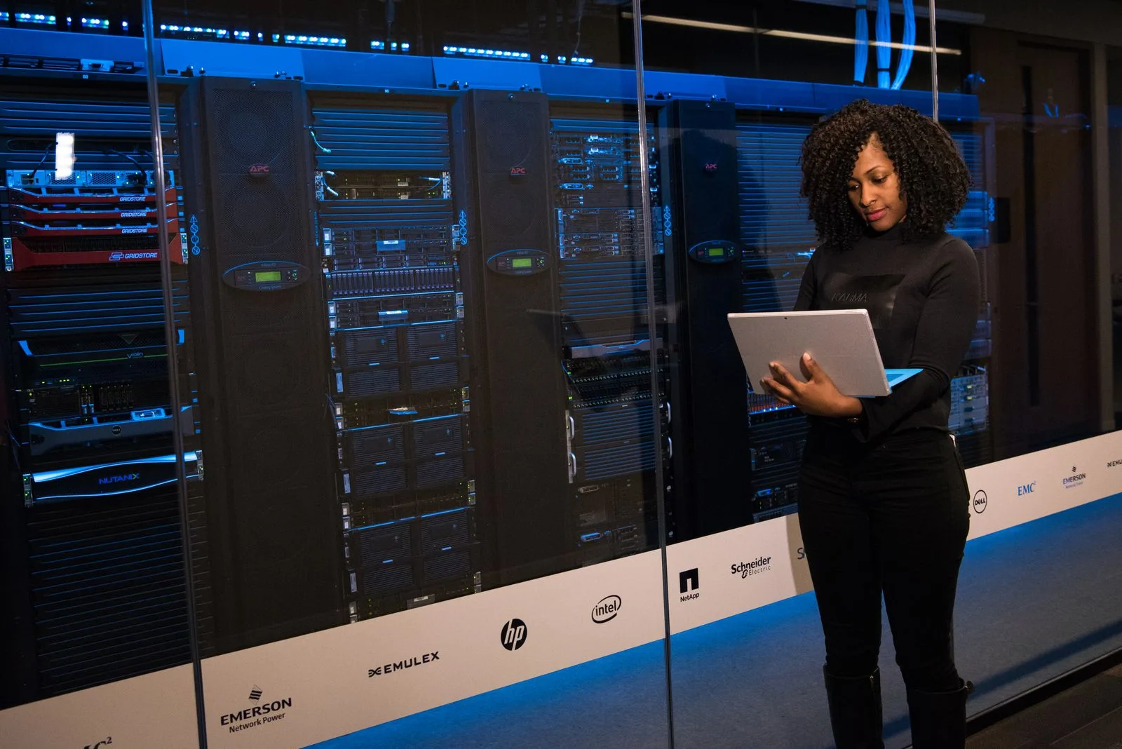 Engineer monitoring servers in a modern data center