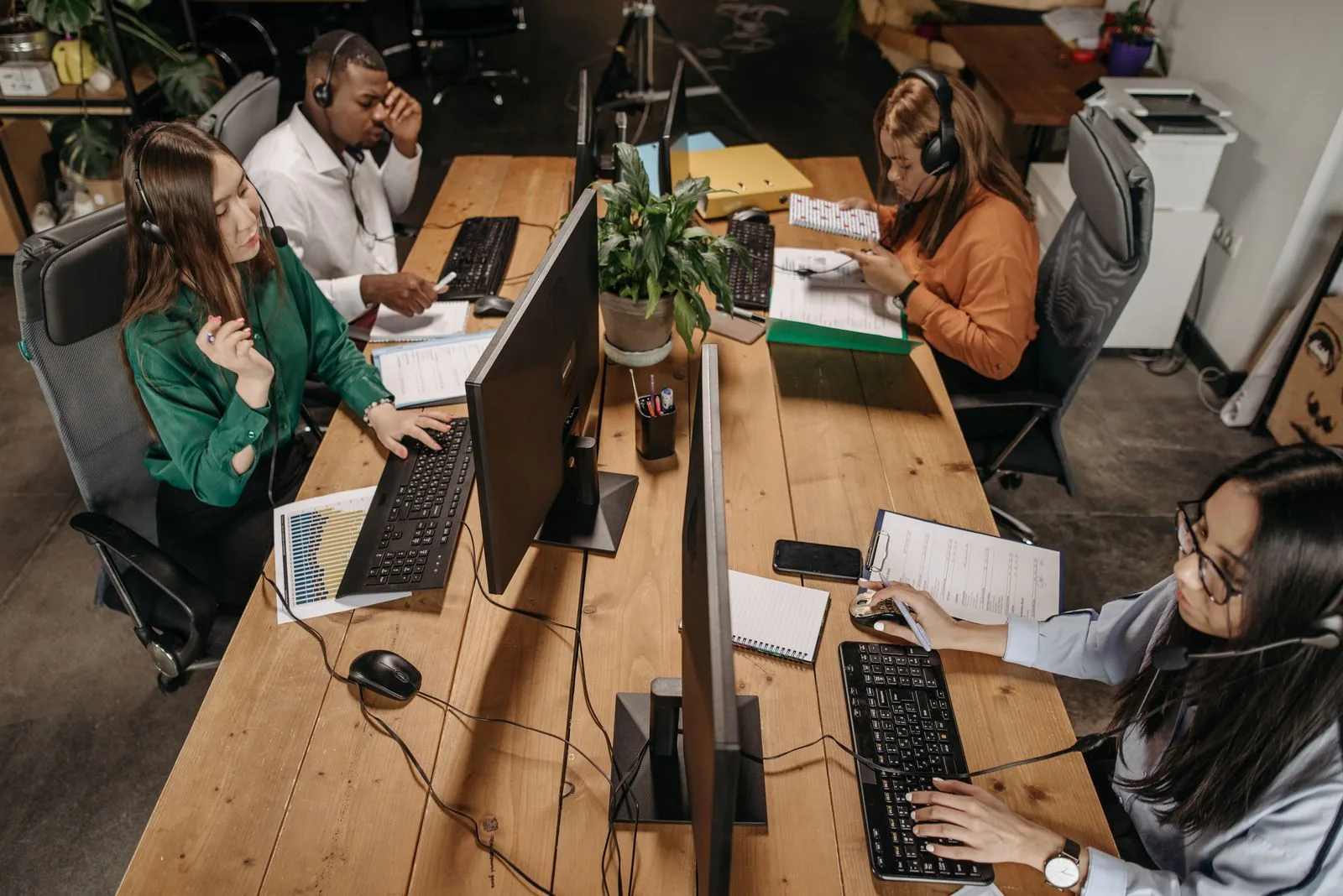 Diverse customer service team collaborating in a modern office