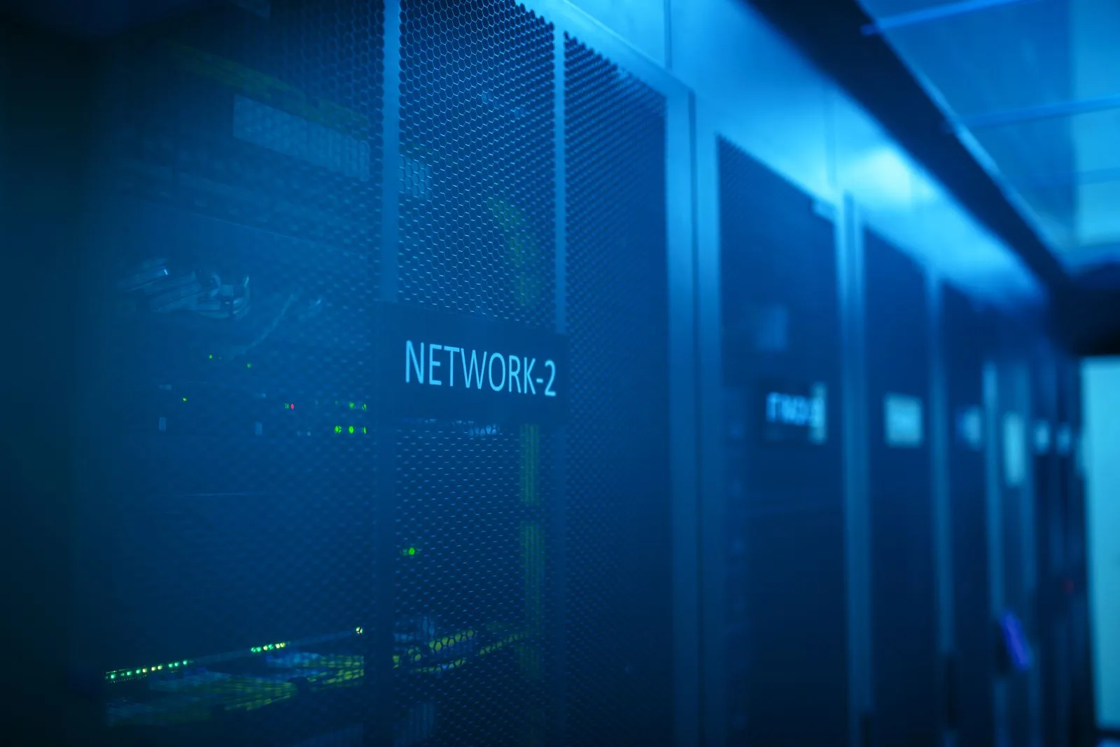 Modern server room with network equipment and blue illumination
