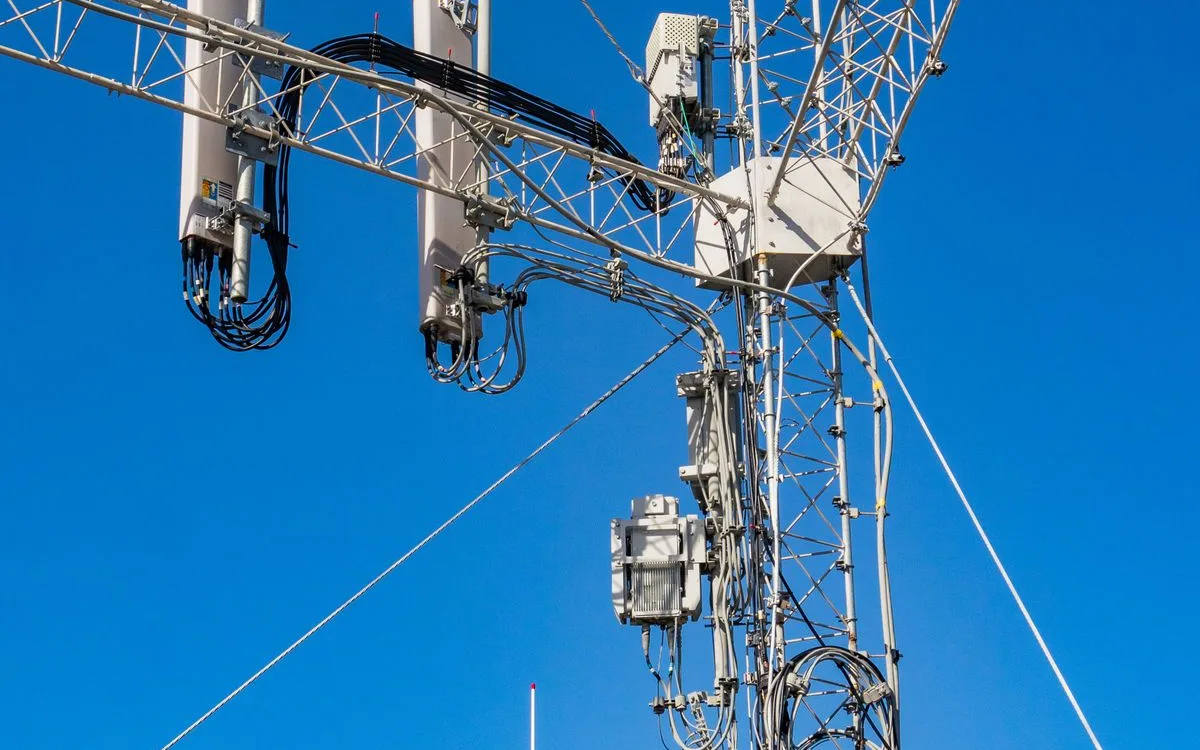 Telecommunication tower against a blue sky